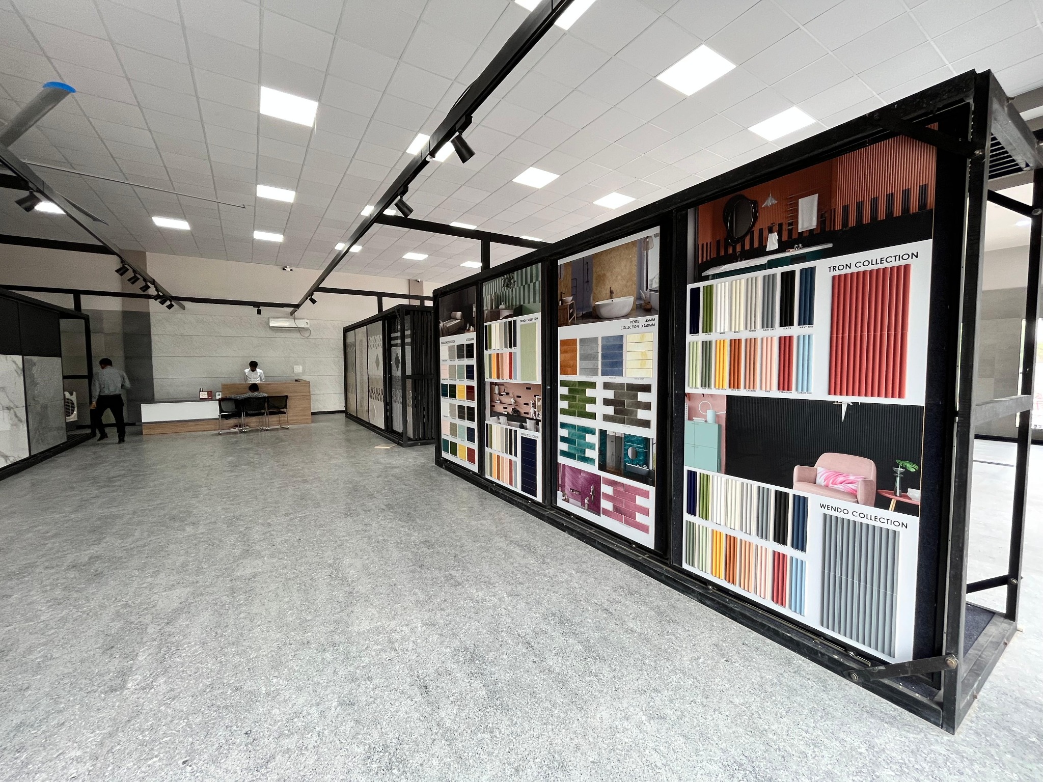 Full-size tile display panels inside The Build Mart showroom